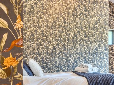 A bedroom with a bed and decorative towels at Manor Farm House in Merton near Bicester