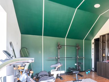 A gym with exercise equipment at Manor Farm House in Merton near Bicester