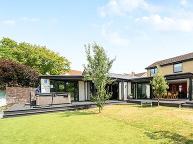 An outdoor space with a hot tub and garden at Manor Farm House in Merton near Bicester