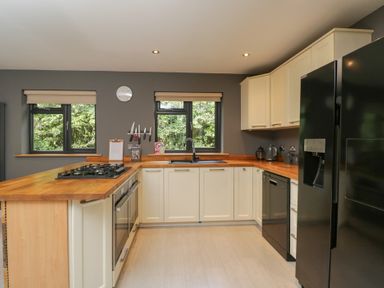A kitchen with a sink and stove at Willow Cottage in Whiteparish