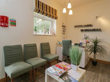 A nail salon with chairs and manicure station at Willow Cottage in Whiteparish