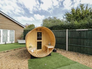 A barrel sauna in the garden at Willow Cottage Whiteparish