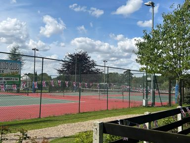 Tennis courts with net and flags at Tennis Club in Woodhall Spa