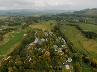 An aerial view of houses and fields at Askrigg in Aysgarth