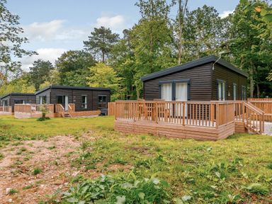 Cabins with decking and grass at Somersby (Pet) Louth