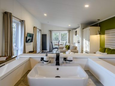 A living room with a sink and sofa at Somersby (Pet) in Louth