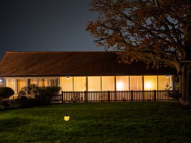 A house with a fence and yard at Nature's Lodge in Cookley