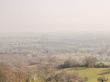 A wide rural landscape with fields and trees visible at Gordons View Pleasant Stile near Gloucester