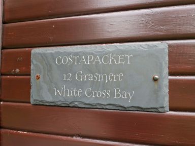 A sign for Costapacket 12 Grasmere White Cross Bay