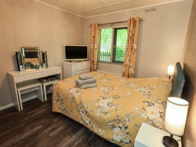 A bedroom with a bed and television at Costapacket, Grasmere 12, White Cross Bay near Windermere