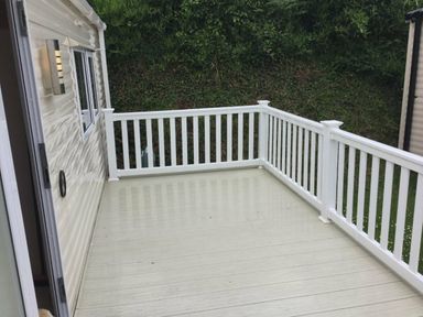 a deck with white railings at Waterside, Paignton - Holiday Accommodation 10036 in Paignton