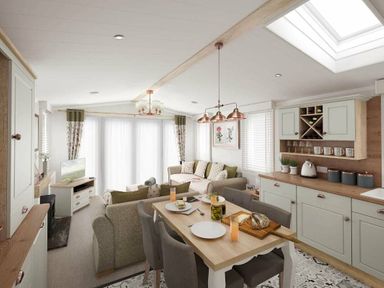 a living room and dining area with a table set for meals at Perran Sands - Holiday Accommodation 12174 Perranporth