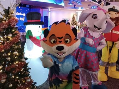 a festive scene featuring costumed characters and a snowman decoration at Hafan y Mor Haven - Holiday Accommodation 12637, Pwllheli