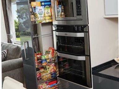 a modern refrigerator with glass-fronted compartments and meals in boxes at Ocean Edge Leisure Park - Holiday Accommodation 1317, Heysham