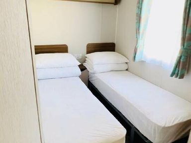 a bedroom with two single beds and pillows at Butlins Minehead - Holiday Accommodation 13288, Minehead