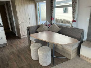 a dining area with a table and seating at Unity Holiday Resort - Holiday Accommodation 15970 Brean Sands