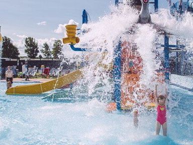 a water park area with a water slide and children splashing at Unity Holiday Resort - Holiday Accommodation 15970 in Brean Sands