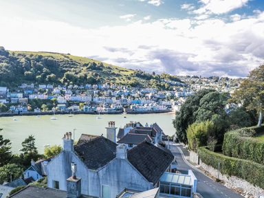 A view of houses and water with boats at Fastnet at Nonsuch House Dartmouth