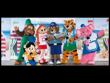 six costumed characters including animals and a child with microphones at Hafan y Mor Haven - Holiday Accommodation 16279 Pwllheli