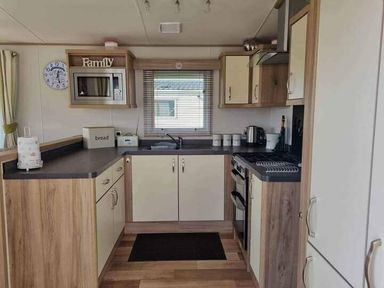 a kitchen with cabinets and appliances at Unity Holiday Resort - Holiday Accommodation 16507 Brean, Somerset, United Kingdom
