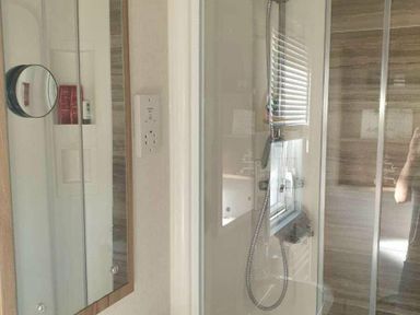 a bathroom with shower and mirror at Unity Holiday Resort - Holiday Accommodation 16507, Brean, Somerset, United Kingdom