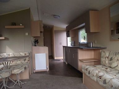 a kitchen and living area with seating and a table at Butlins Minehead - Holiday Accommodation 1700 in Minehead