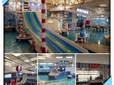 indoor water park featuring slides, pools, and play areas at Hafan y Mor Haven - Holiday Accommodation 17436 Pwllheli