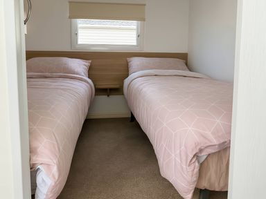 A bedroom with two beds at Golden Gate Holiday Centre - Holiday Accommodation 19058 Towyn