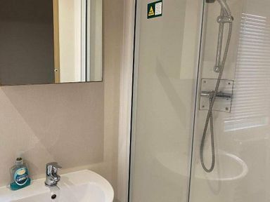 a bathroom with a shower and sink at Butlins Skegness - Holiday Accommodation 19332 in Skegness