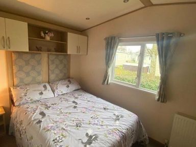 a bedroom with a double bed and window at Butlins Skegness - Holiday Accommodation 19332 in Skegness