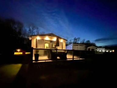 a holiday accommodation with lights on at night at Lakeland Leisure Park - Holiday Accommodation 20788 Flookburgh