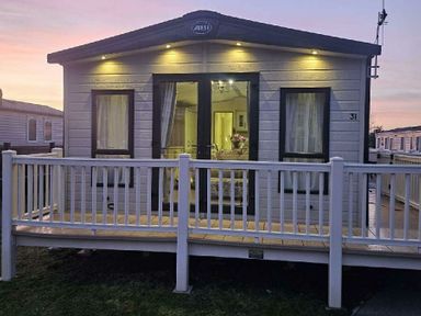 a holiday home exterior with a decking area at Tattershall Lakes Country Park - Holiday Accommodation 21501, Tattershall