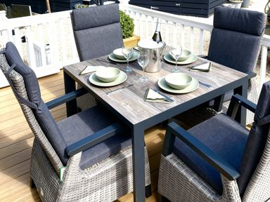 An outdoor dining area with a table and chairs at Aberdunant Hall Holiday Park - Holiday Accommodation 21962 in Prenteg