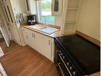 a kitchen with a sink, countertop, and oven at Butlins Skegness - Holiday Accommodation 22071 in Ingoldmells