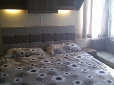 a bedroom with a bed, bedside table, and a seating area at Waterside, Paignton - Holiday Accommodation 2287, Paignton