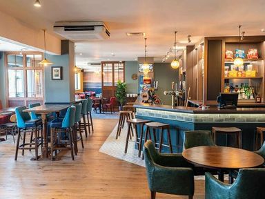 a bar area with tables and chairs at Waterside, Paignton - Holiday Accommodation 2287 in Paignton