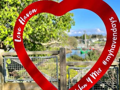 a large red heart frame with text and a view of a water area at Hafan y Mor Haven - Holiday Accommodation 7421 Pwllheli