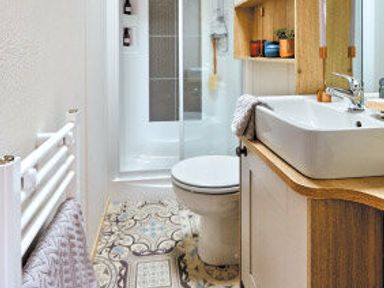 a bathroom with a shower cubicle, sink, and toilet at Perran Sands - Holiday Accommodation 7528, Perranporth, Cornwall, United Kingdom