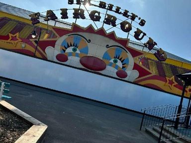 a clown-themed entrance to a fairground at Butlins Minehead - Holiday Accommodation 826 Minehead