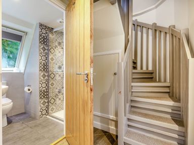 A bathroom with a shower and toilet at St Ives Studio in Praze-An-Beeble