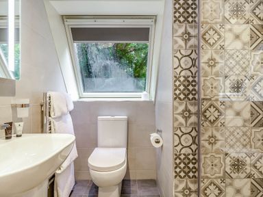 A bathroom with a toilet and sink at St Ives Studio, Praze-An-Beeble