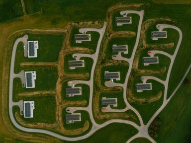 An aerial view of houses and roads in a rural area at Darwin Retreat in Aspatria