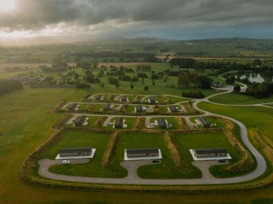 An aerial view of a layout with houses and cars at The Sheraton Retreat in Aspatria