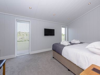 A bedroom with a bed and a TV at Wordsworth in Wigton