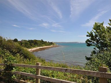 A view of the beach and sea at Harbourside Apartment in Weymouth