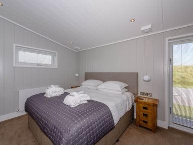 A bedroom with a bed and nightstand at Wellington in Wigton