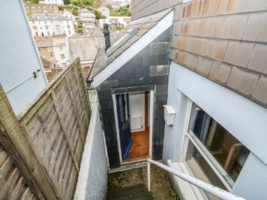 An outdoor staircase leading to a door at 58A South Ford Road Dartmouth