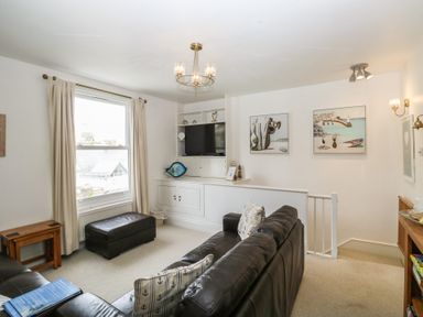 A living room with a sofa and television at 58A South Ford Road Dartmouth