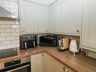 A kitchen with appliances on a counter at 58A South Ford Road Dartmouth