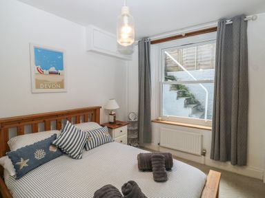 A bedroom with a bed and window at 58A South Ford Road in Dartmouth